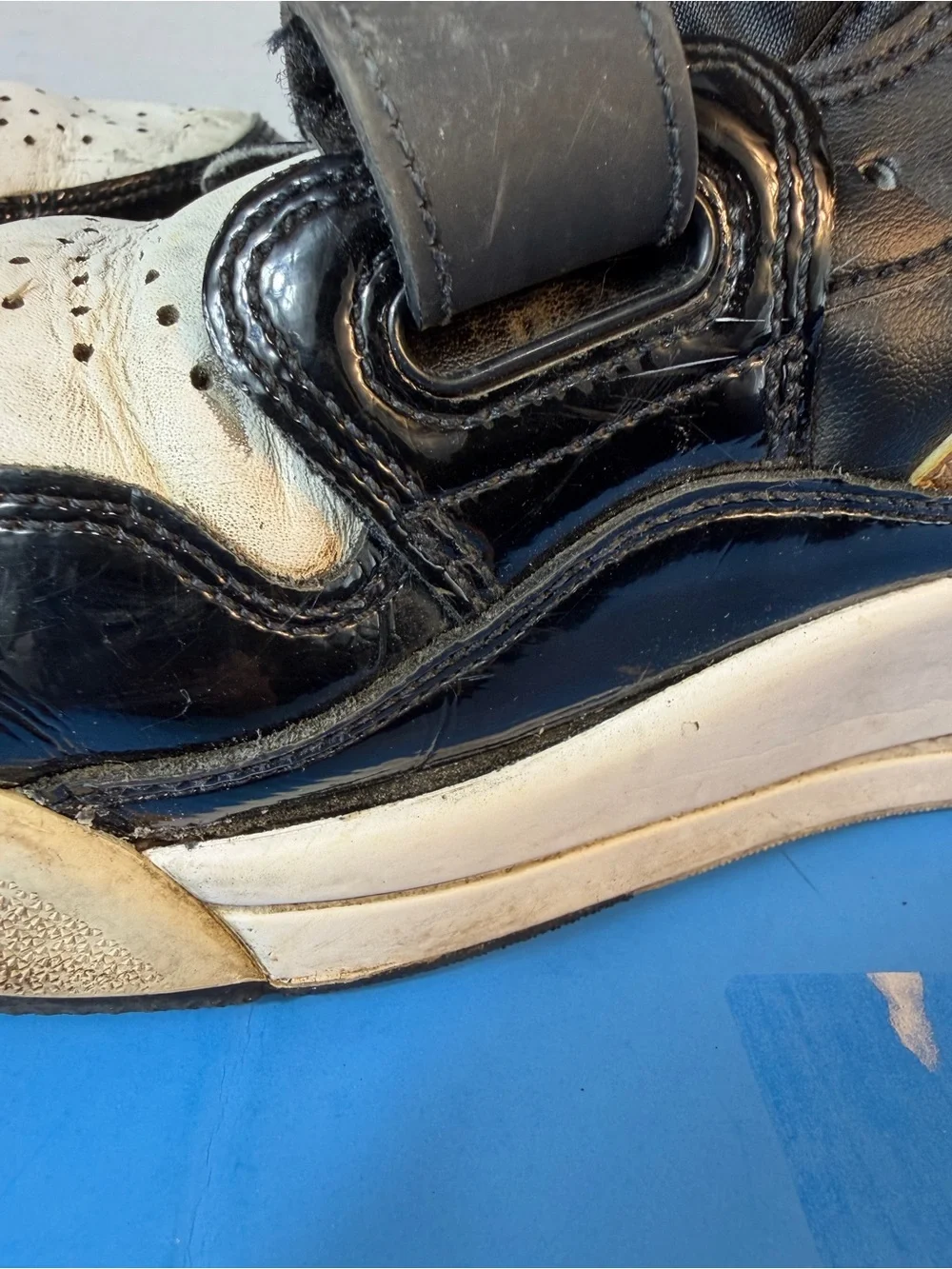 Jordan Black, White & Gold Strap Sneakers